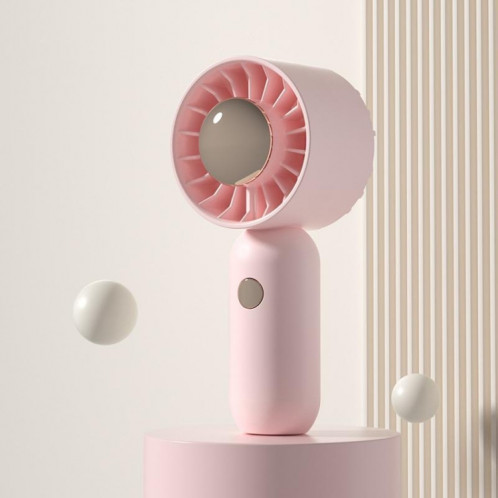 La main tient un petit ventilateur de poche portable, style : version rose avec placage par pulvérisation. SH4105485-310