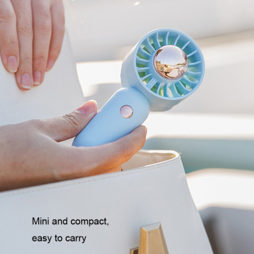 La main tient un petit ventilateur portable Mini ventilateur de poche, style : version de placage vert. SH4107828-010